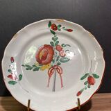Easternth century earthenware plate, ribboned floral decoration