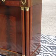 Flamed mahogany enfilade with sea green marble in Empire style.