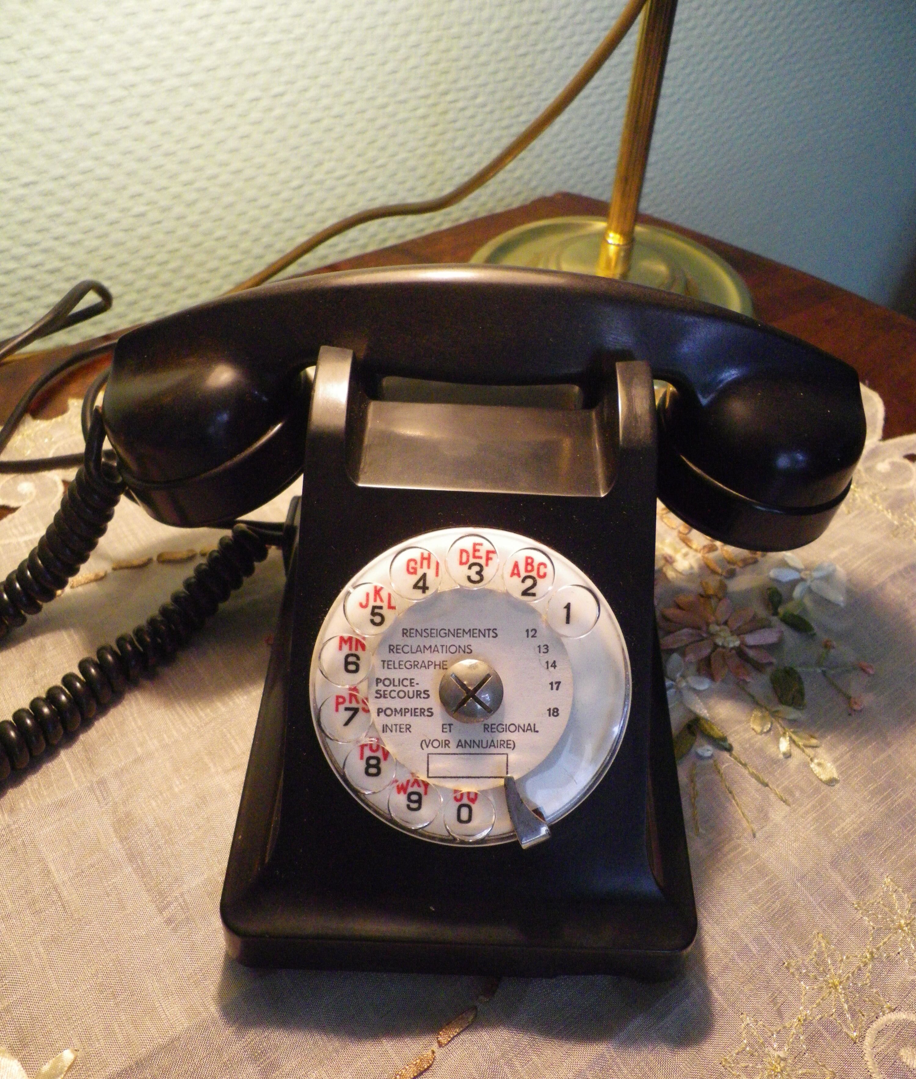 Black bakelite phone with earphone