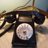 Black bakelite phone with earphone