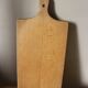 Wooden cutting board with handle