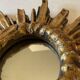 Miroir soleil vintage en bois doré