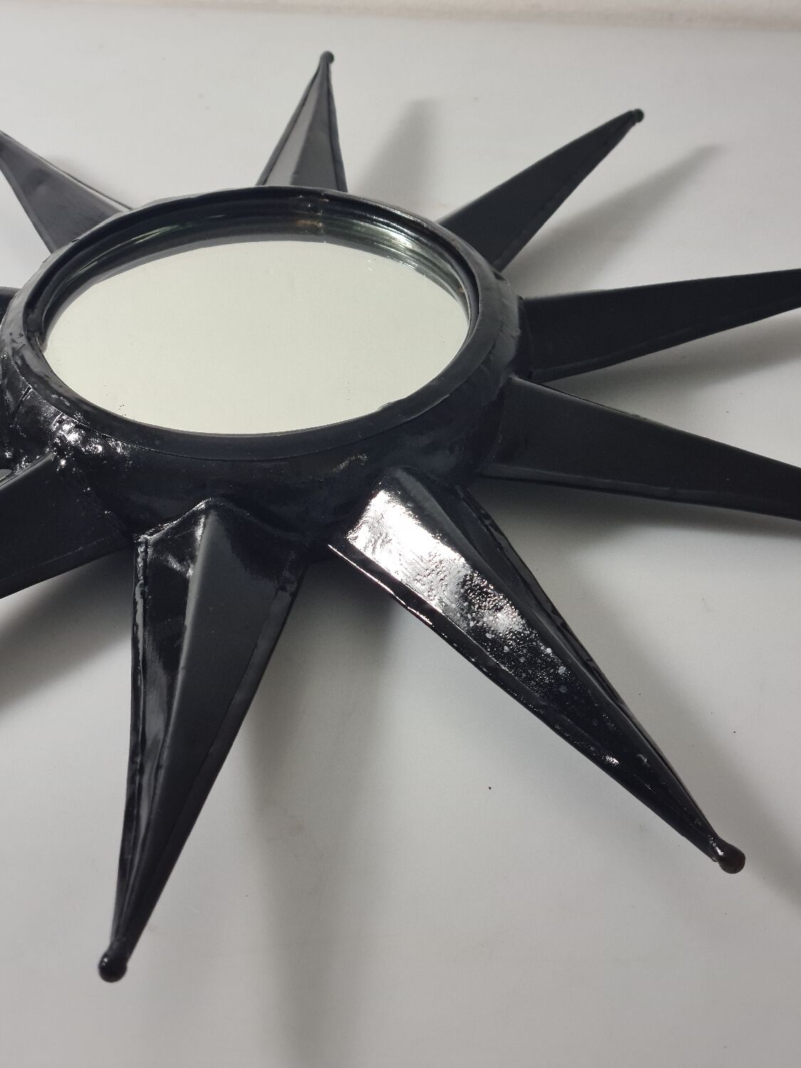 Antique metal star wall mirror black