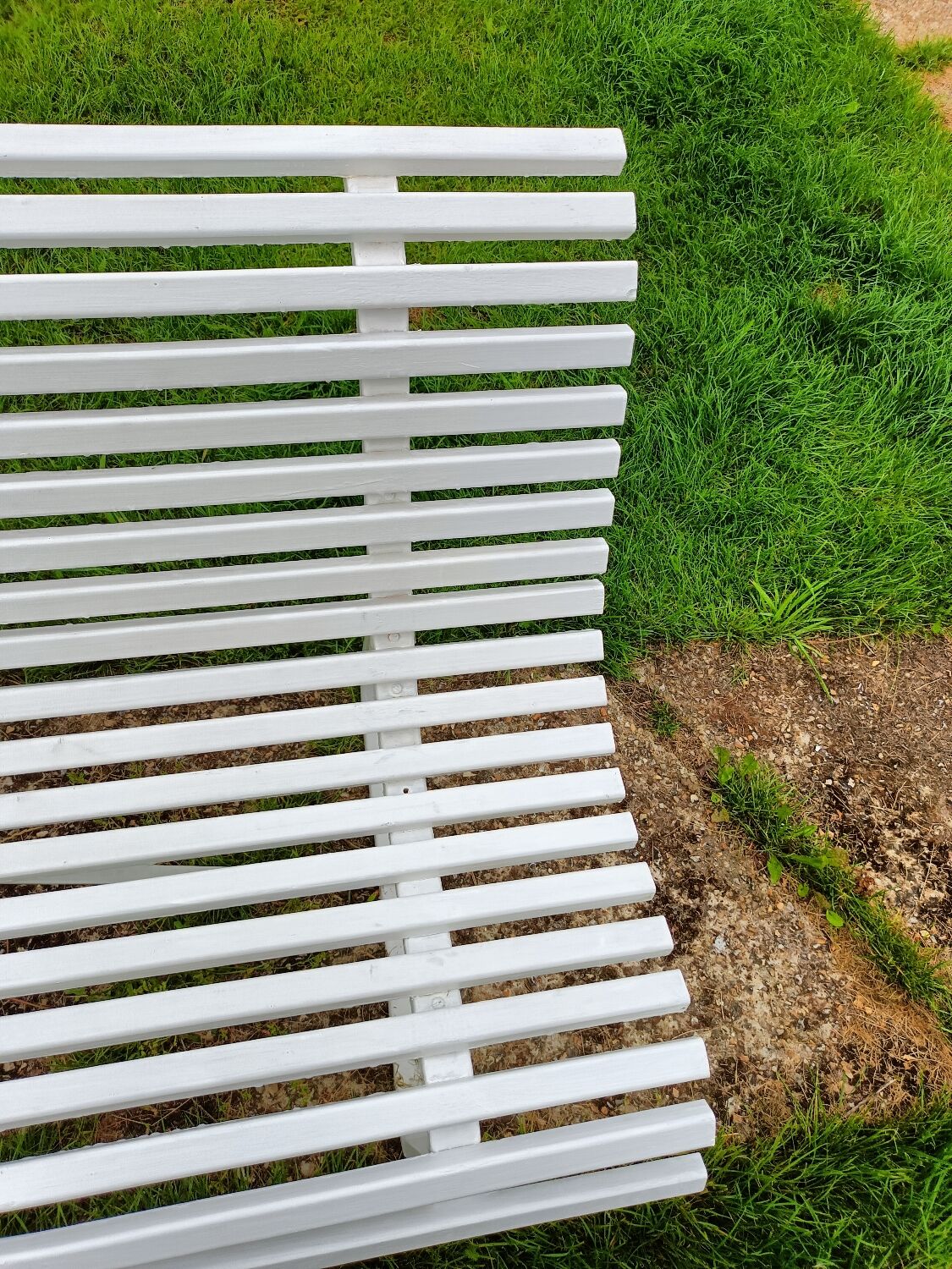 Antique garden bench with metal legs