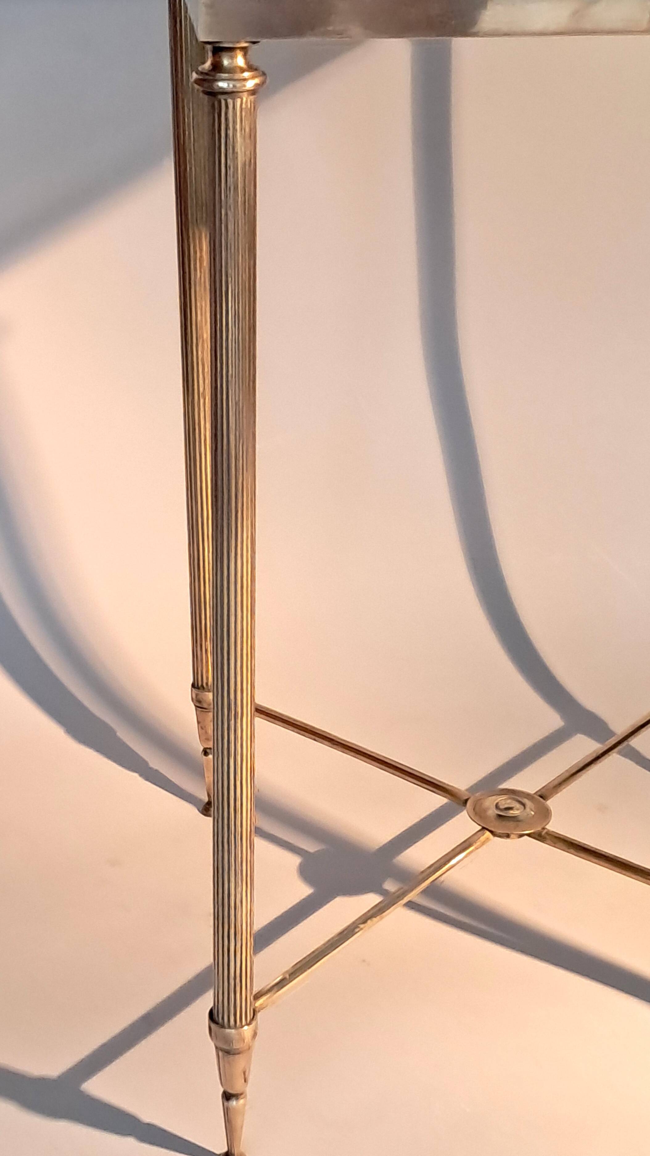 Gold brass side table in neoclassical style, circa 1960.