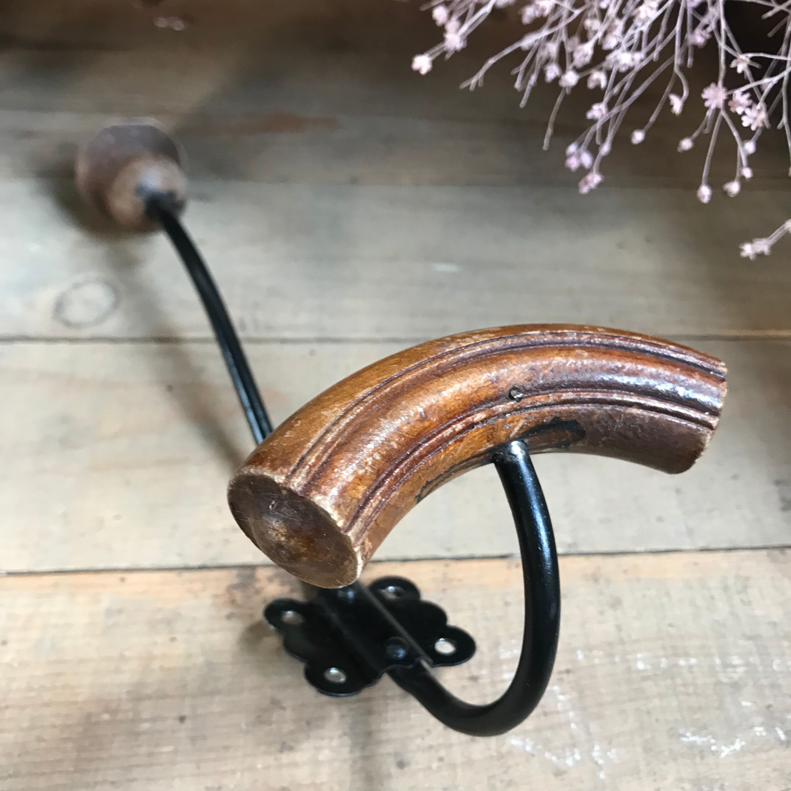 Pair of old wood and metal hooks