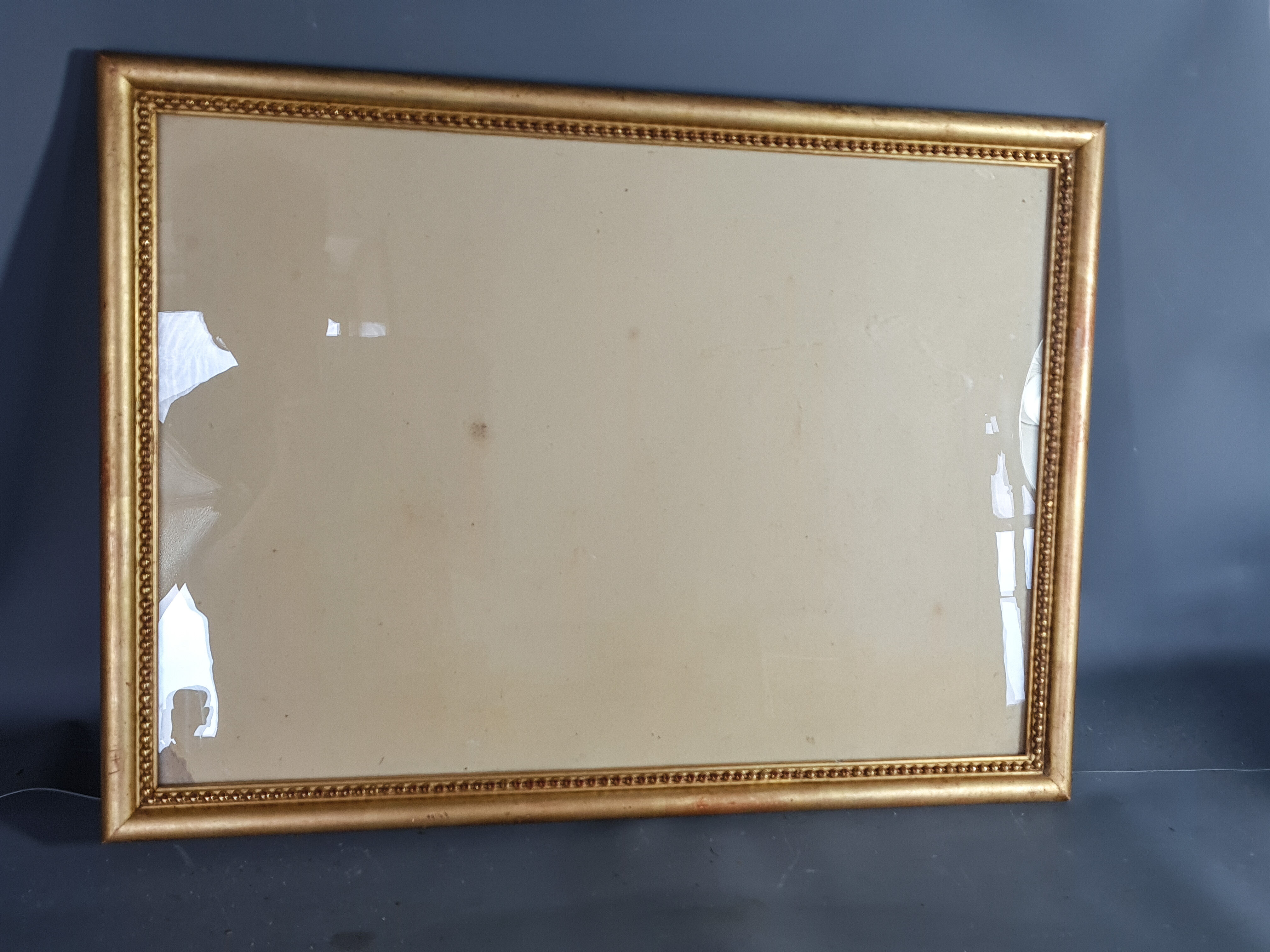 Old frame beaded decoration, gilded stucco wood