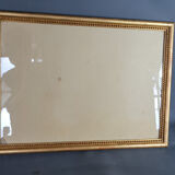 Old frame beaded decoration, gilded stucco wood