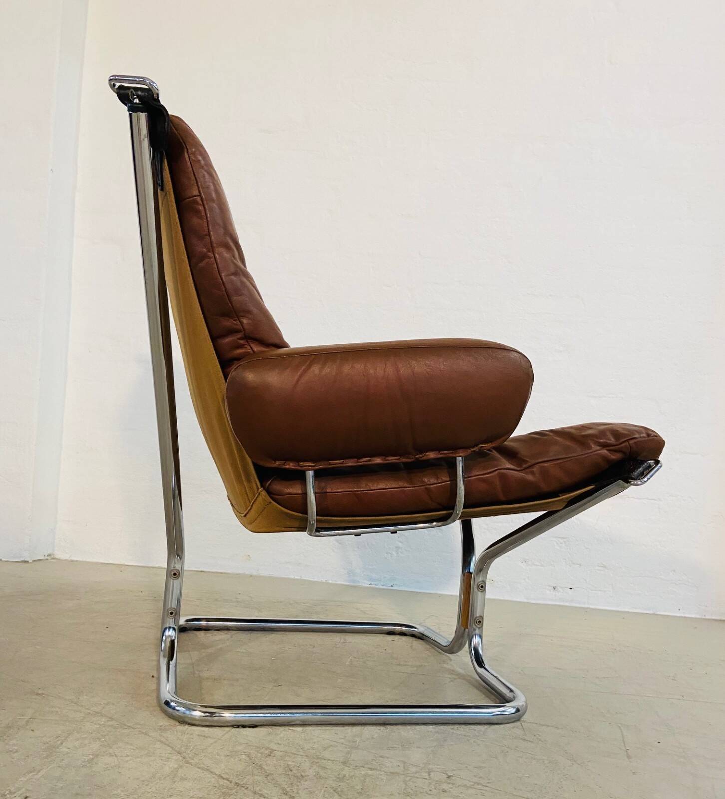 Vintage mid-century Scandinavian cognac leather lounge chair by Harald Relling
