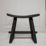 Curved burnt wood stool