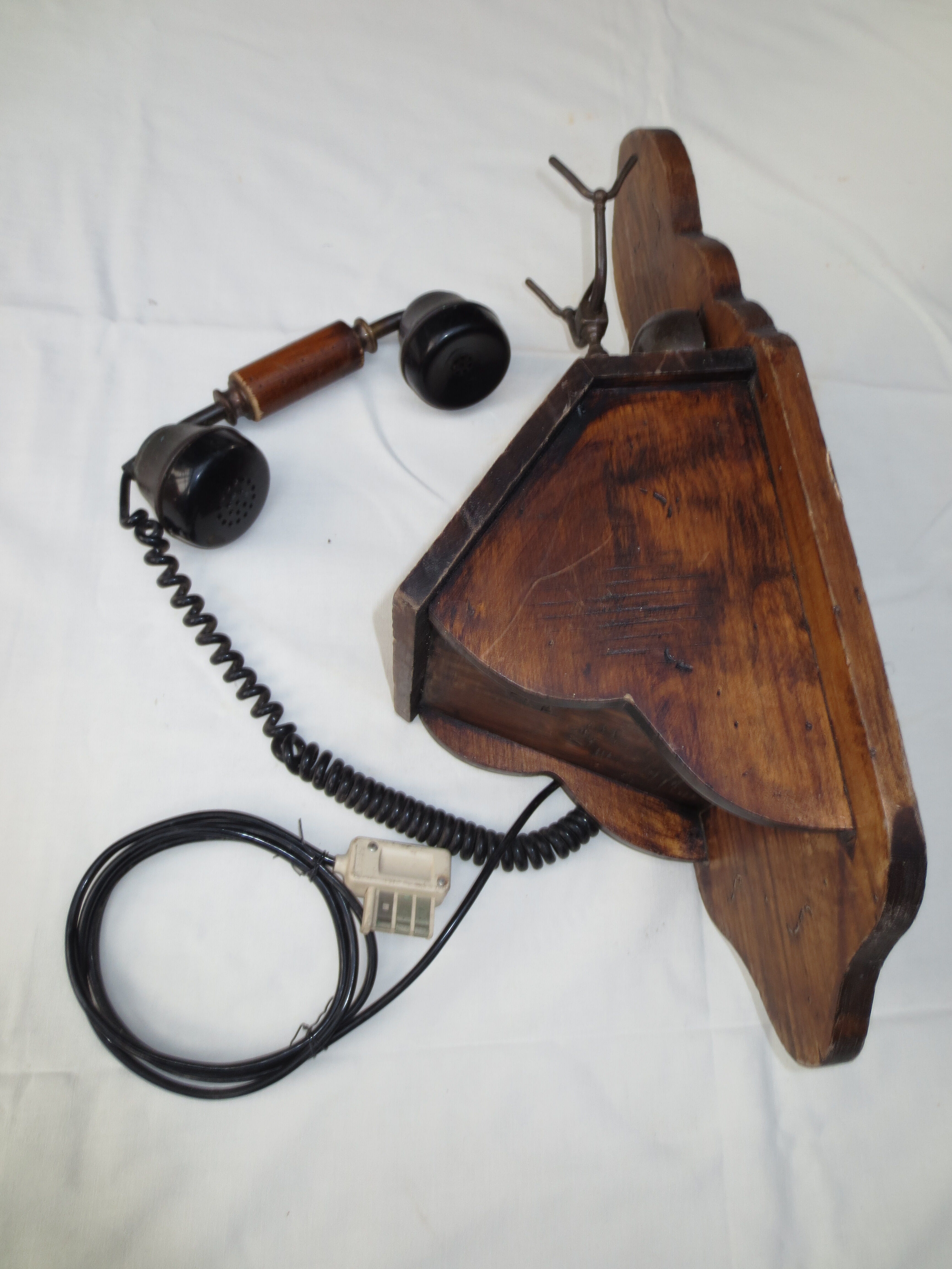 Old wood and metal wall phone