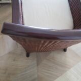 Vintage colonial-style armchair in woven rattan and exotic wood
