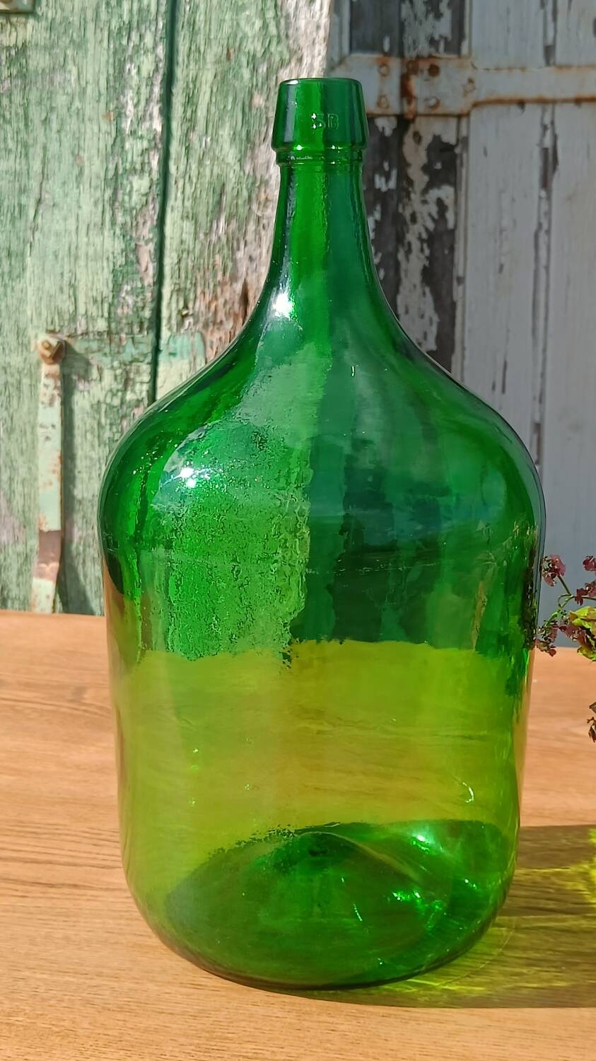Superb antique green glass demijohn.