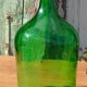 Superbe dame jeanne ancienne en verre vert
