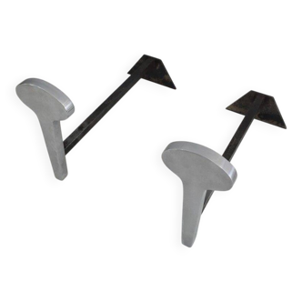 Pair of modernist andirons in chromed steel and wrought iron