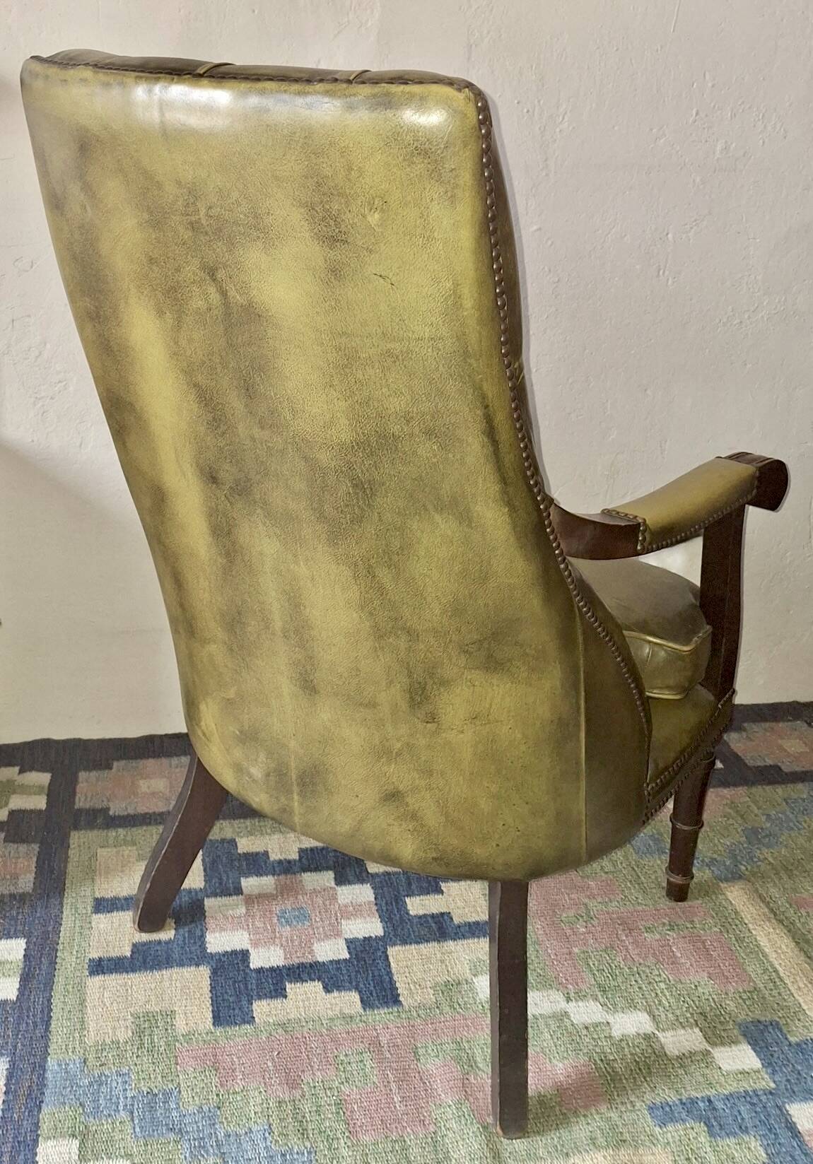 Olive green tufted leather library armchair, 1970s