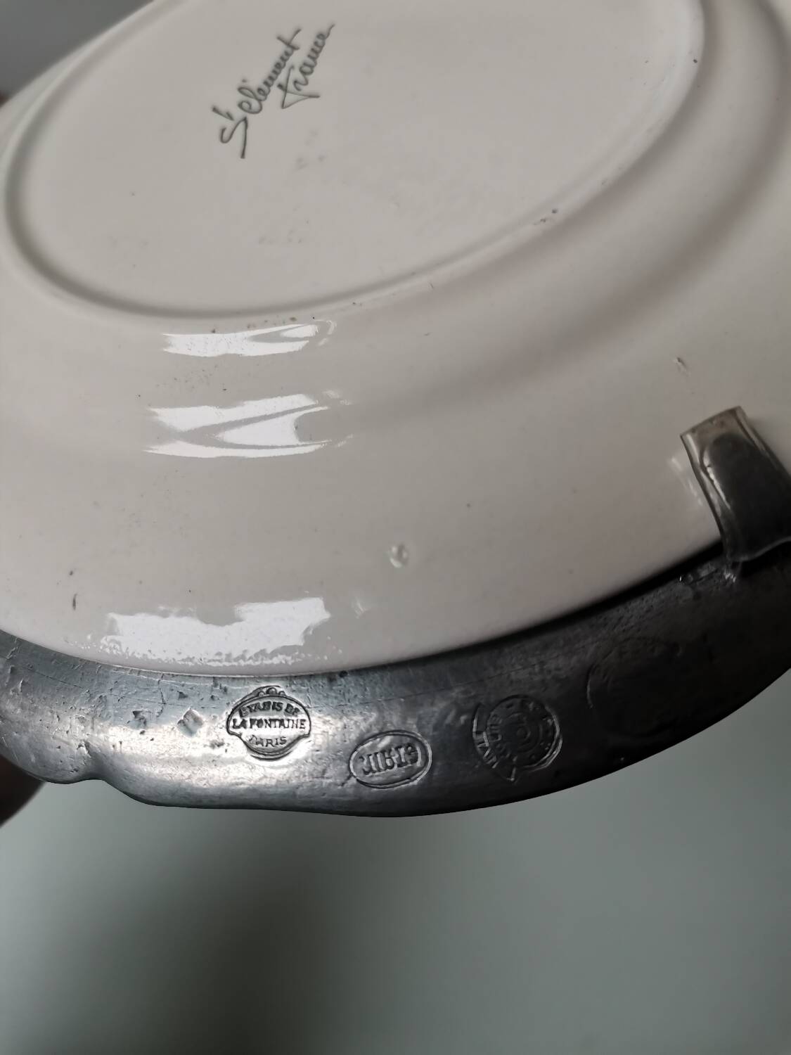 Vintage St Clément plate to hang with pewter frame stamped pewter of the fountain France