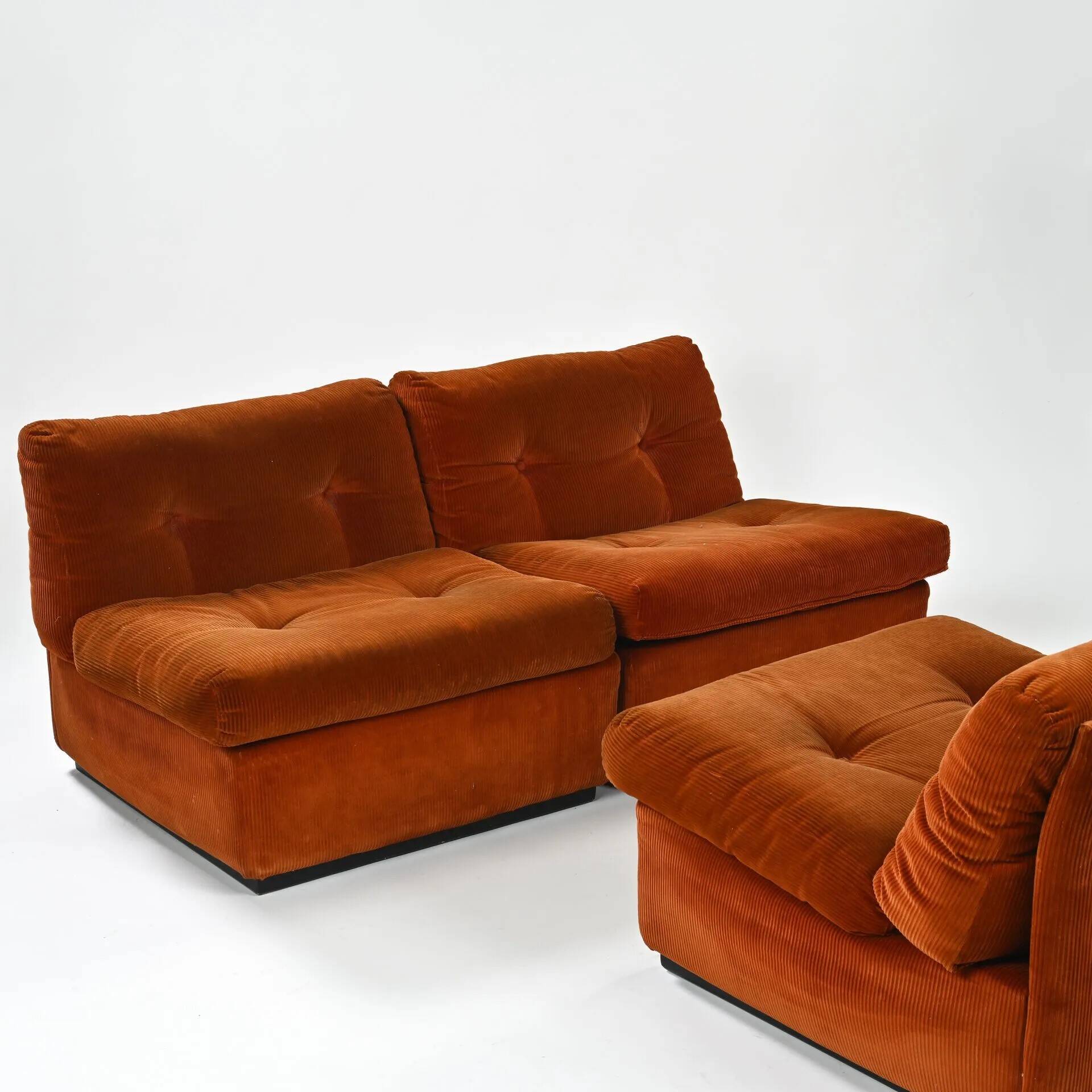 Set of three vintage armchairs. 1970s. Orange corduroy.