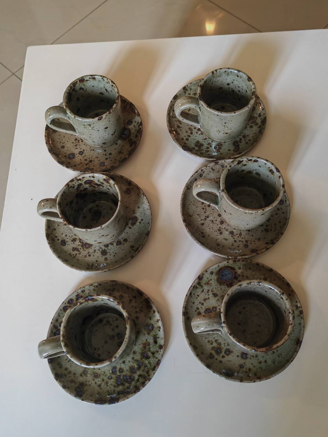 Series of stoneware cups and saucers