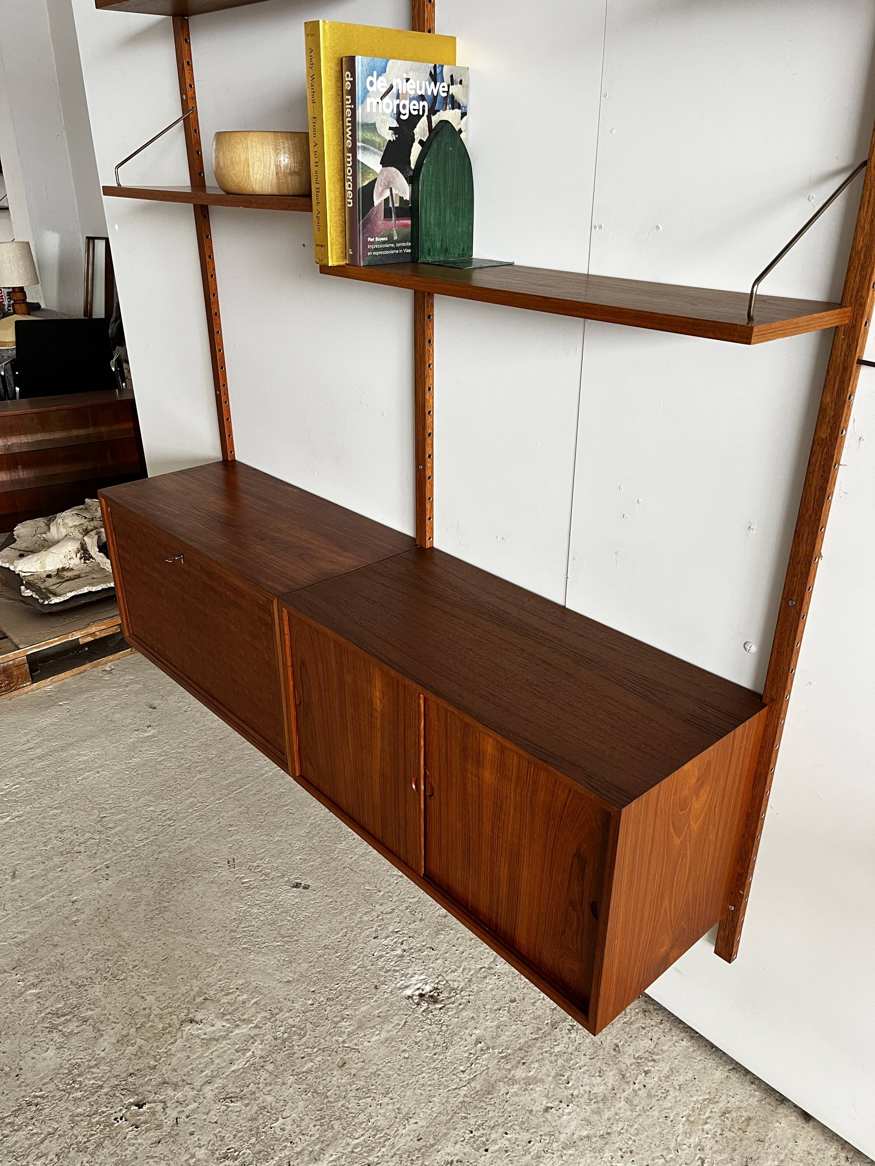 A wall unit with 4 compartments by Poul Cadovius, Denmark, 1960s.