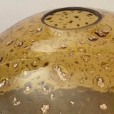 Large amber globe with glittery bubbles