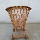 Rattan cradle for doll on vintage wheels