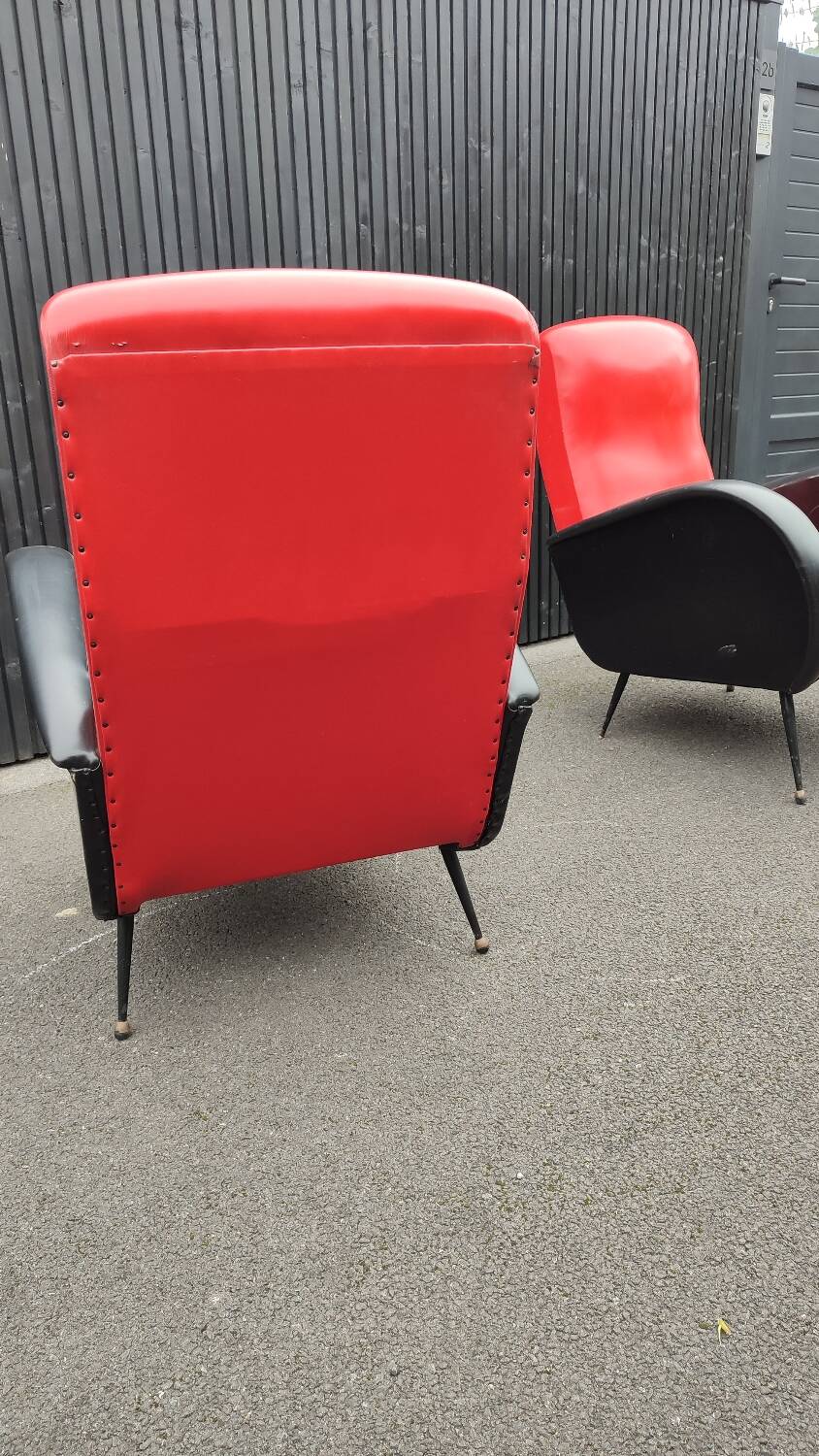 Pair of red and black faux leather armchairs