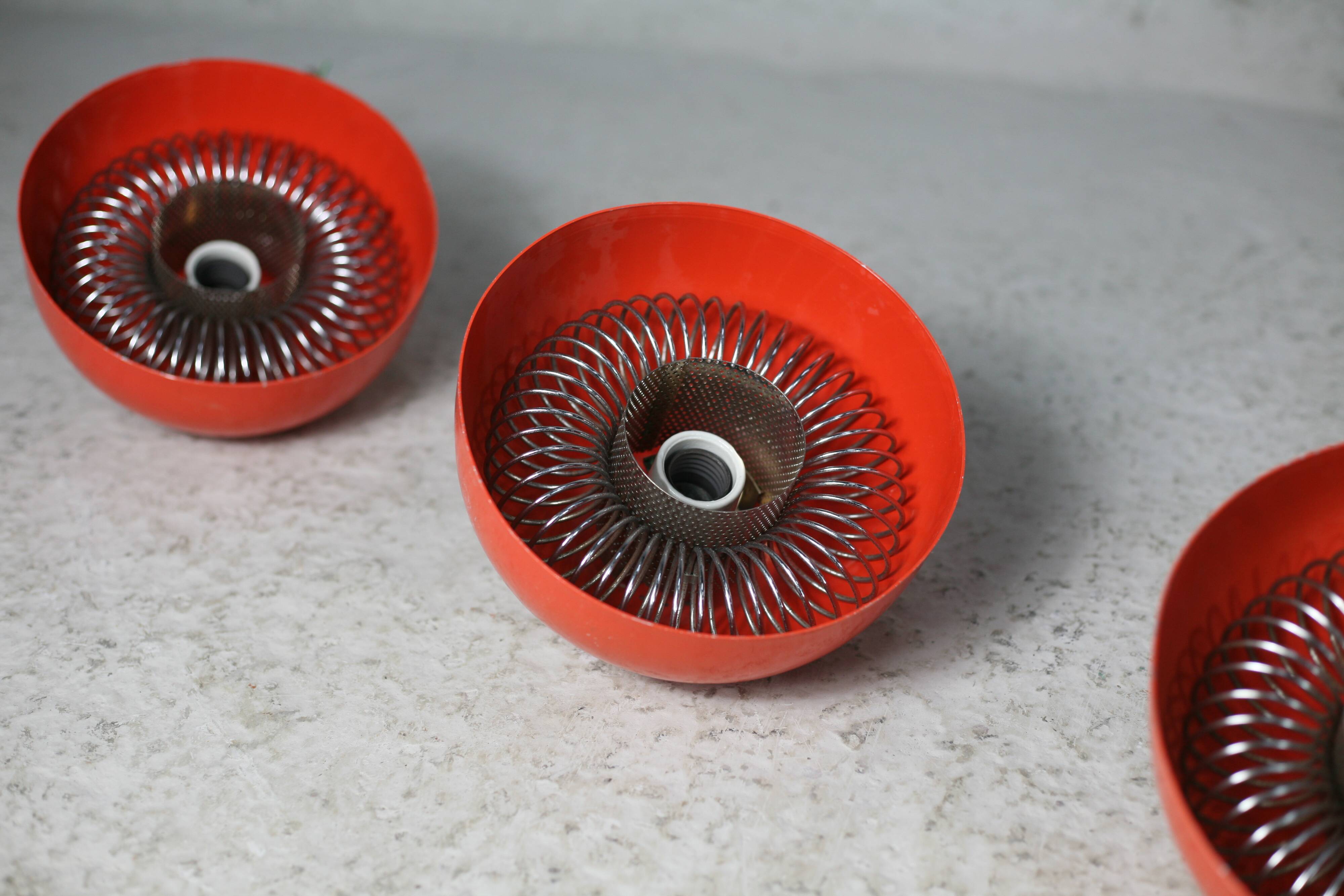 Set of 4 "spring" hanging lamps, orange steel, France, circa 1970