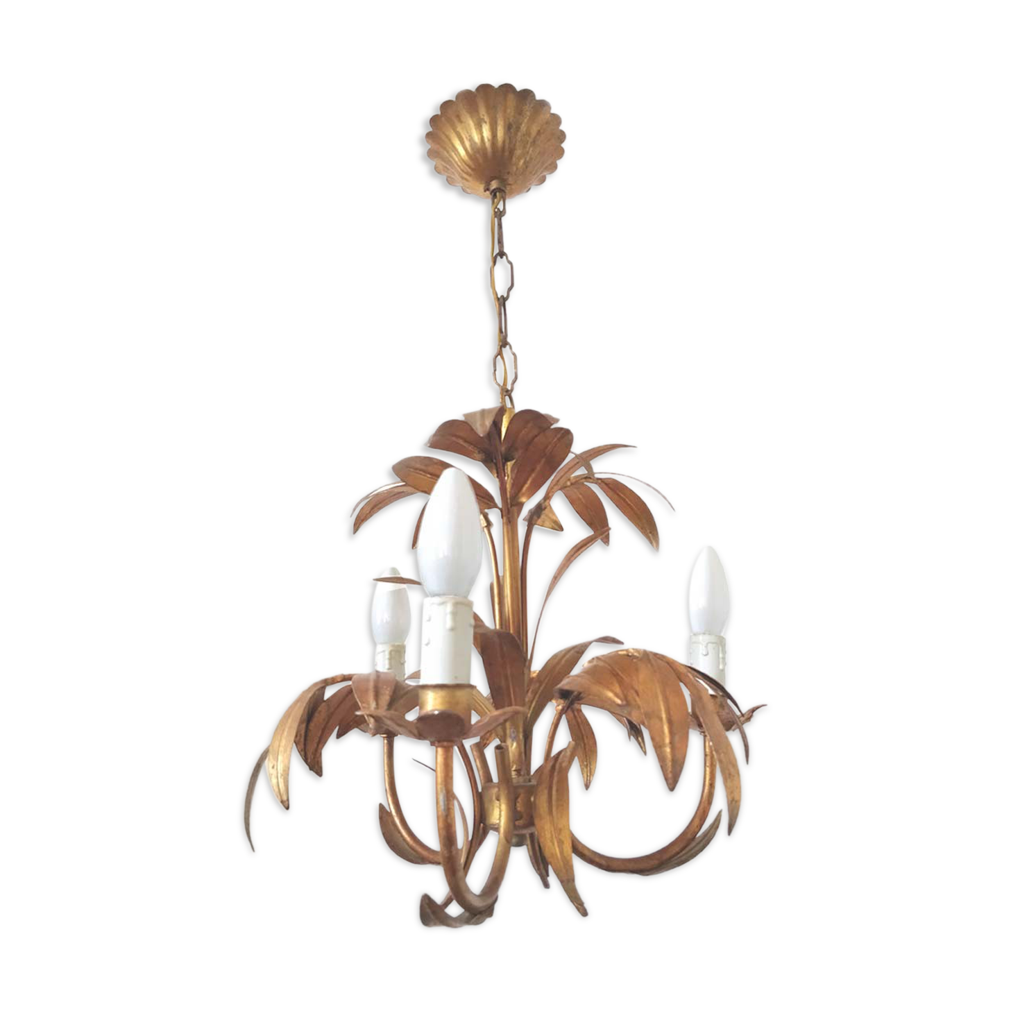 Golden metal chandelier palm leaves