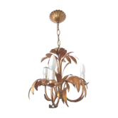 Golden metal chandelier palm leaves