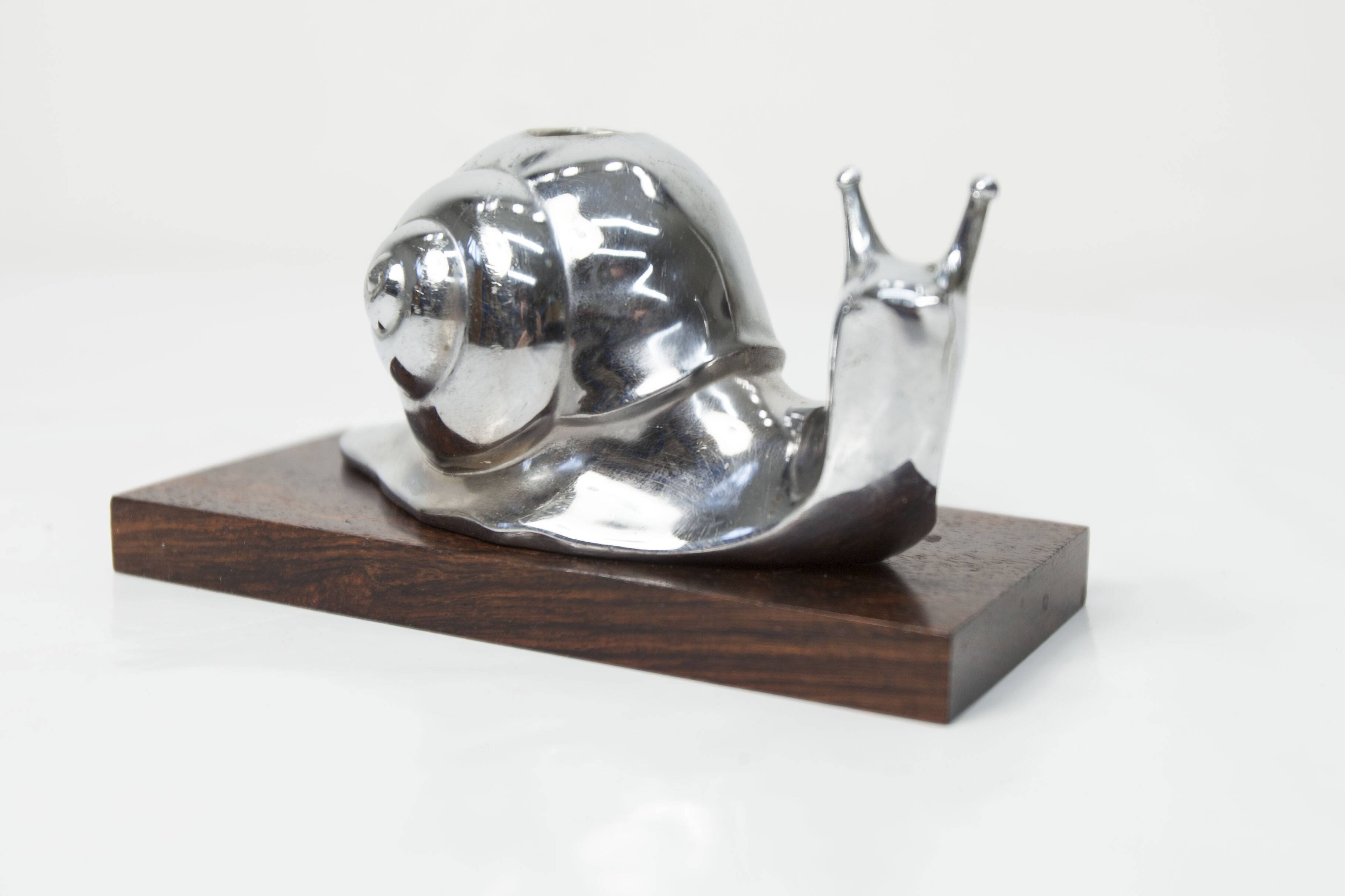 Silver snail candlestick on a teak base 1960