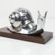 Silver snail candlestick on a teak base 1960