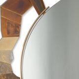 Contemporary mirror in oxidized bronze and brass with a deconstructed shape.