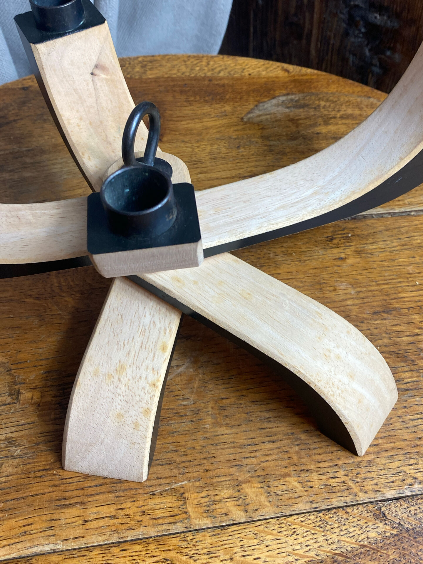 Foldable and deconstructed chandelier, minimalist Swedish design in wood.