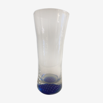 Glass roller vase with blue bubble background