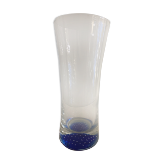 Glass roller vase with blue bubble background