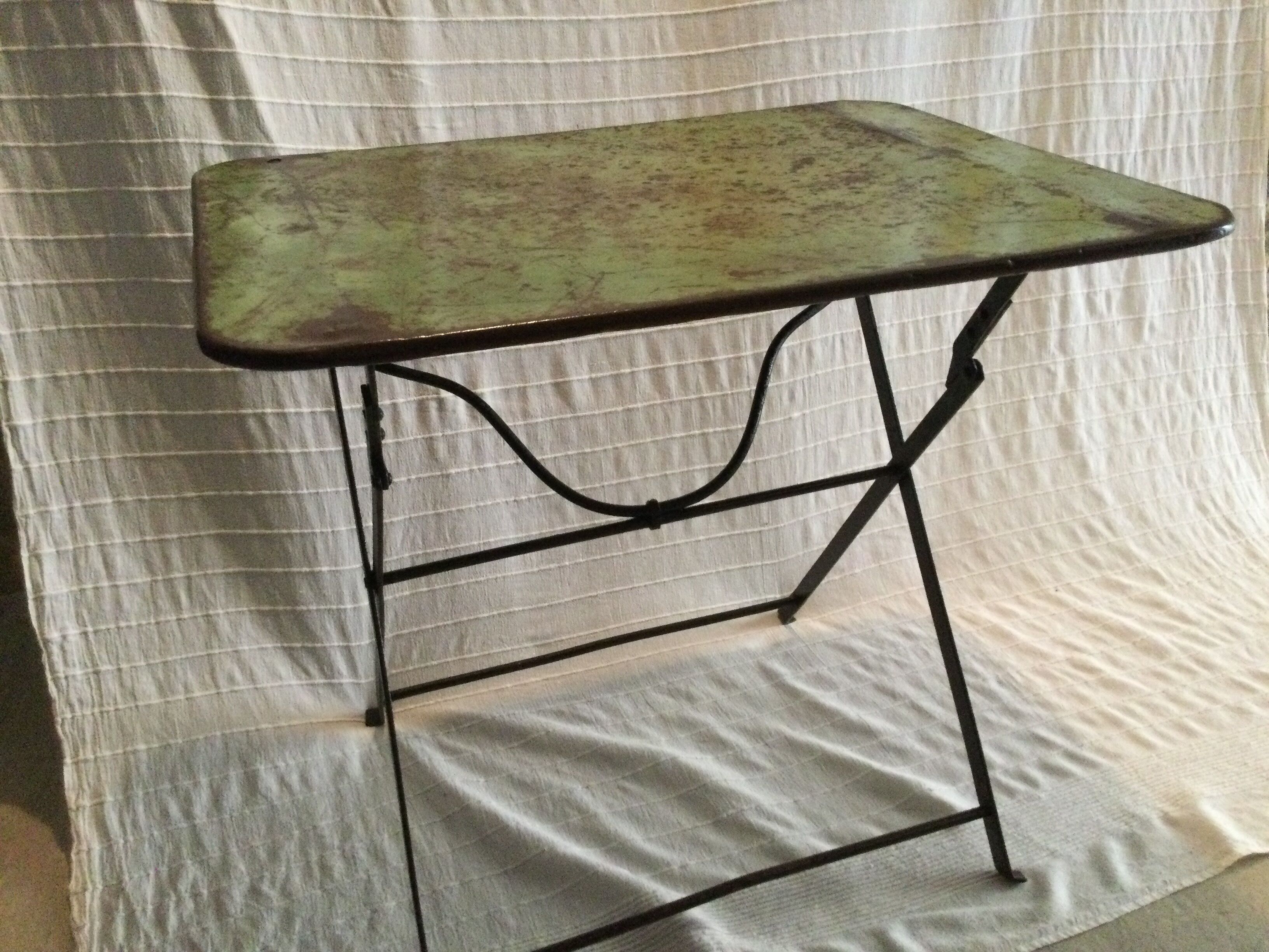 Folding riveted iron table