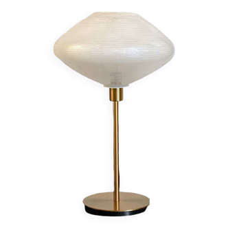 Table lamp with a vintage glass globe and saucer and a golden foot