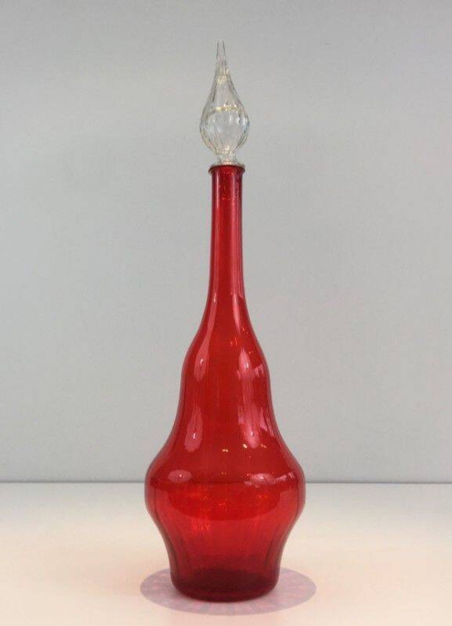 Large designer bottle in red glass
