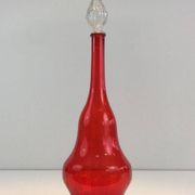 Large designer bottle in red glass