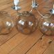 Chrome metal chandelier with smoked glass globes.