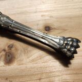Old sugar or ice cube tongs