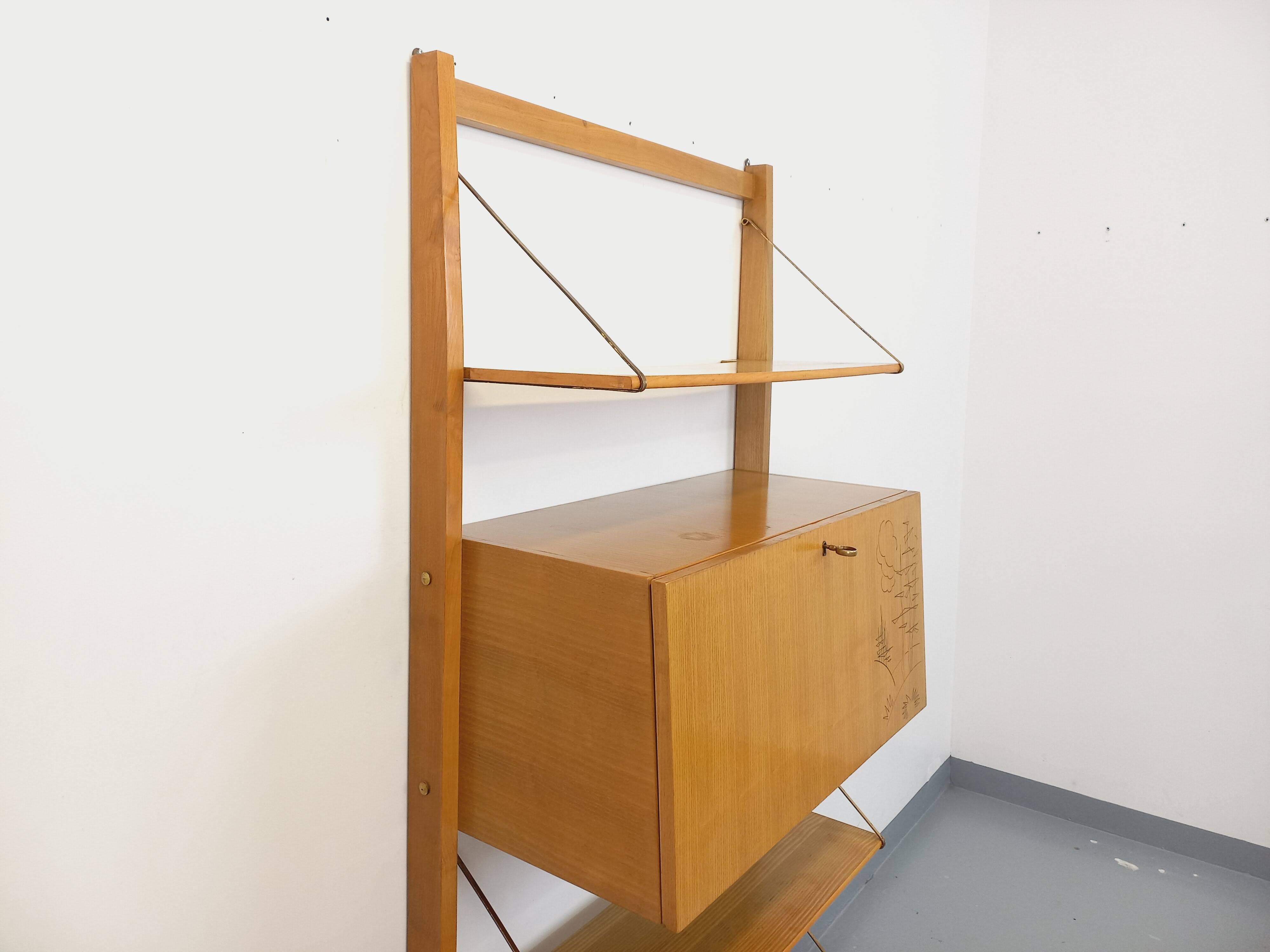 Wall shelf library with vintage light wood secretary bar