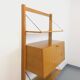 Wall shelf library with vintage light wood secretary bar