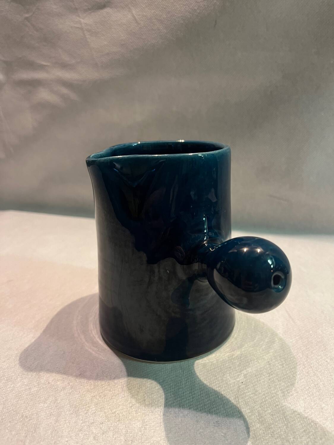 Blue ceramic milk jug