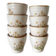 Stoneware egg cups, floral decoration