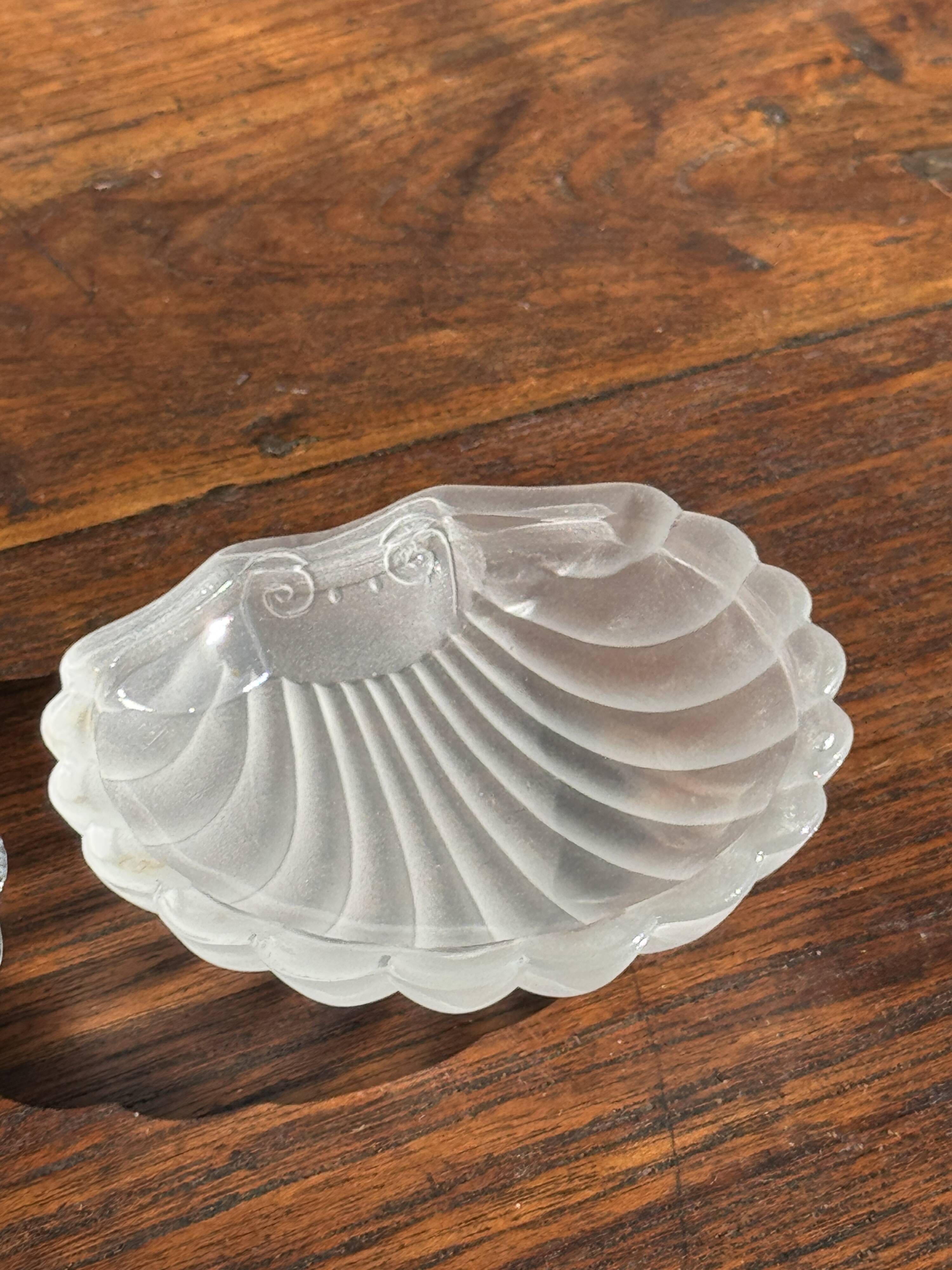 Vintage silver-plated shell butter dish with transparent bowl.