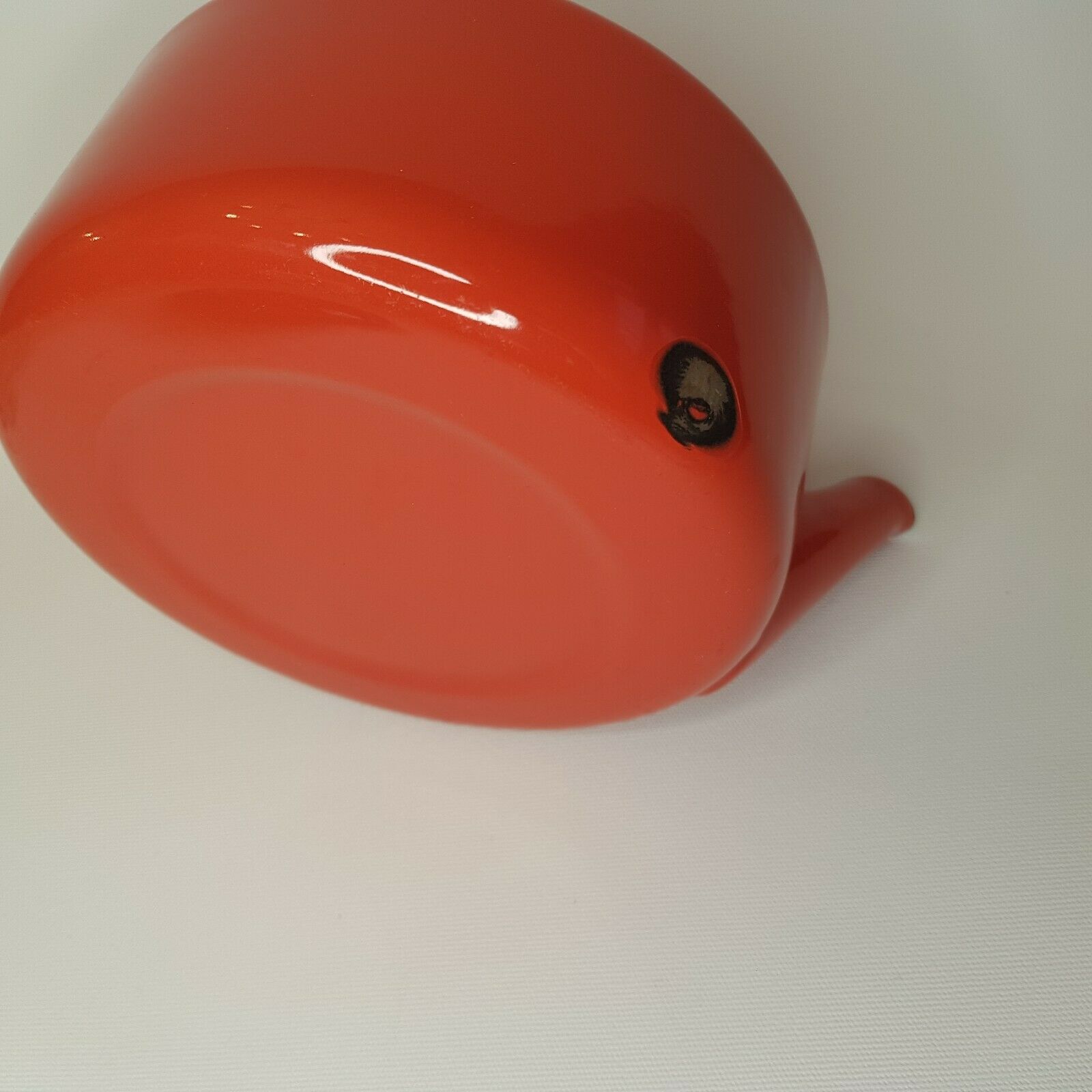 Orange and bamboo enamelled metal teapot in the 1970s