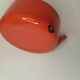 Orange and bamboo enamelled metal teapot in the 1970s