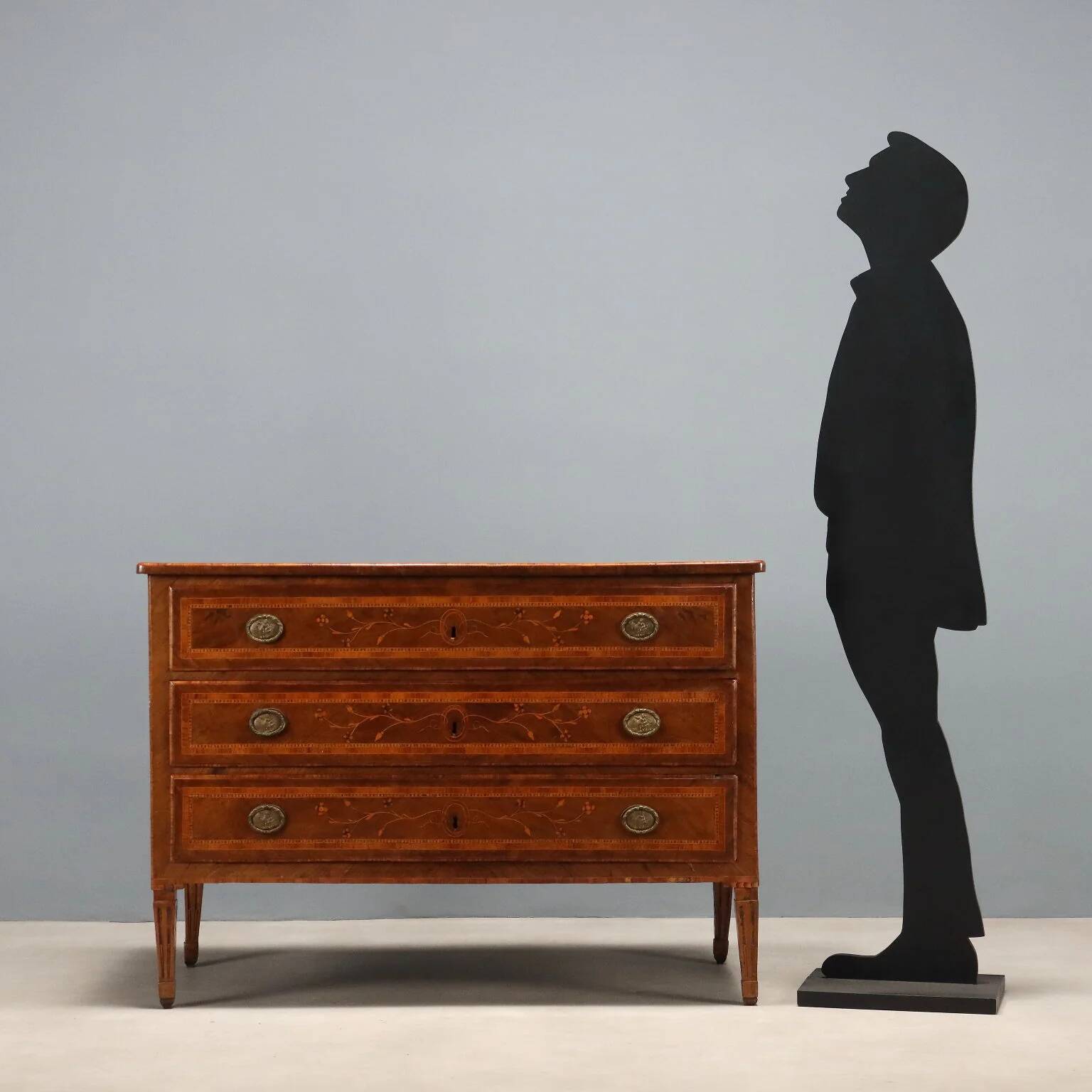 Antique neoclassical walnut commode from the 18th century.